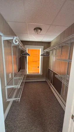 a view of an empty room with a fireplace