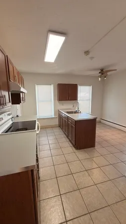 a kitchen with stainless steel appliances a sink and a stove