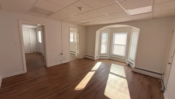 a view of entryway with wooden floor