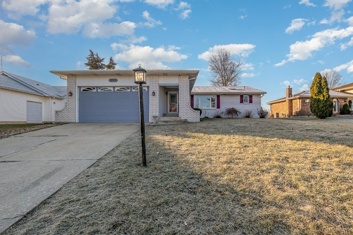 1286 Brandywine Road Crown Point, IN 46307 - Photo 2 of 30 a view of a house with a yard and garage