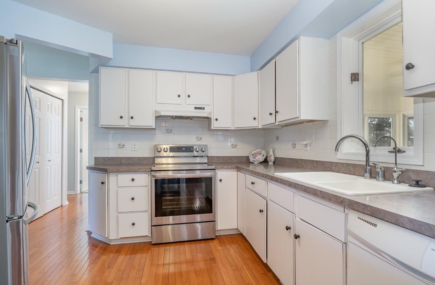 1286 Brandywine Road Crown Point, IN 46307 - Photo 10 of 30 a kitchen with stainless steel appliances granite countertop a sink stove and cabinets