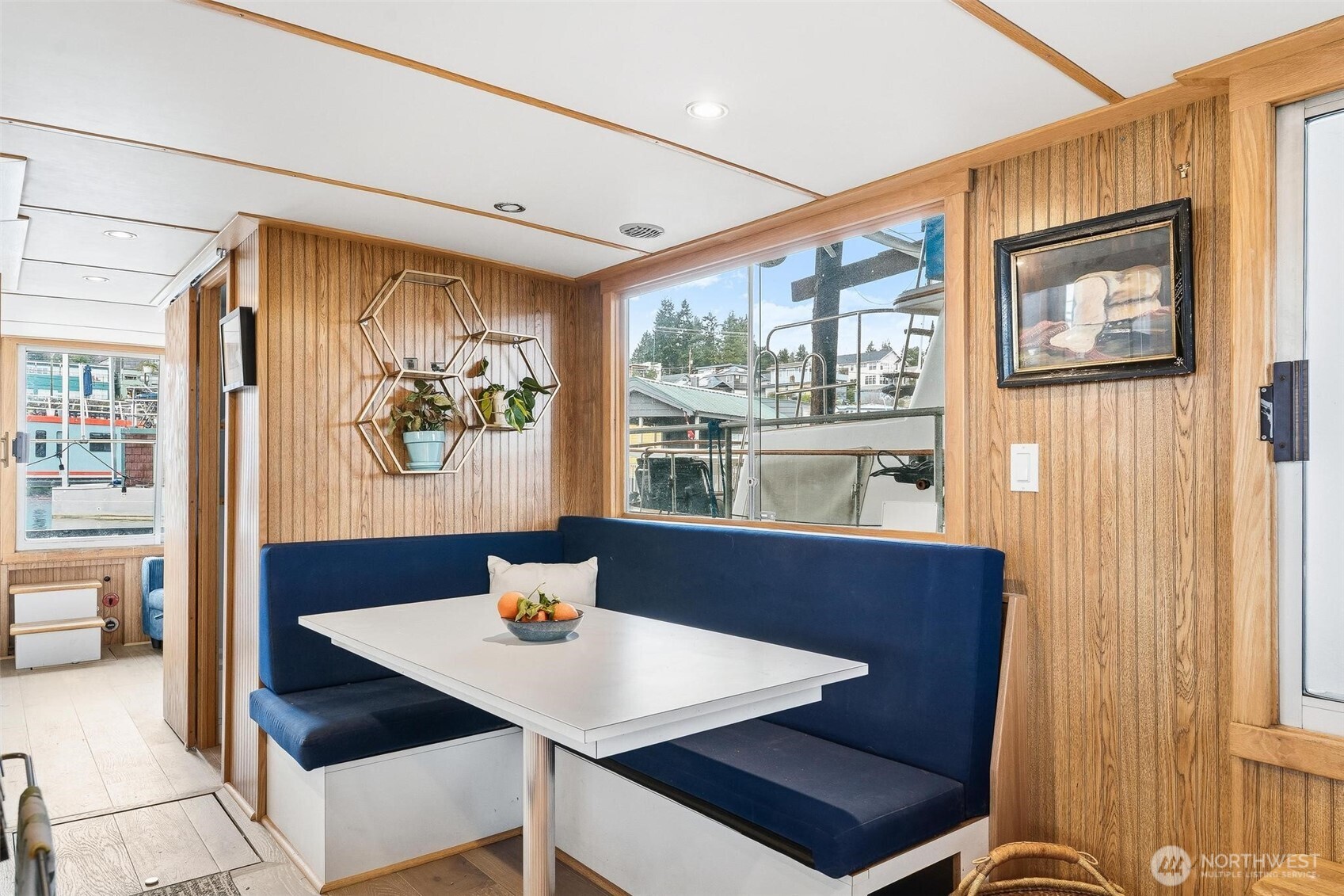 2401 North Northlake Way Seattle, WA 98103 - Photo 3 of 25 a view of a dining room with furniture a livingroom and wooden floor