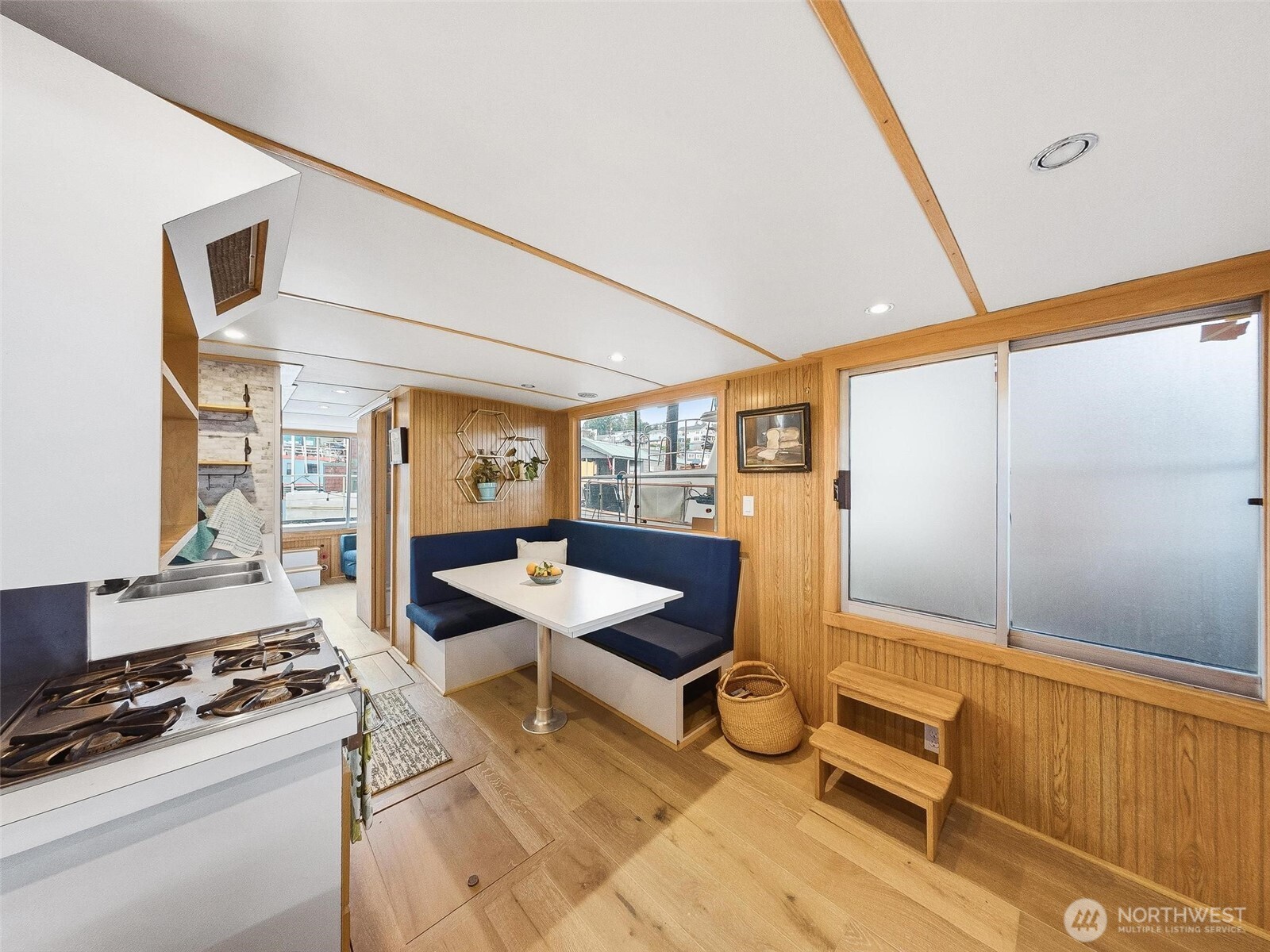 2401 North Northlake Way Seattle, WA 98103 - Photo 5 of 25 a room with furniture a rug and white walls