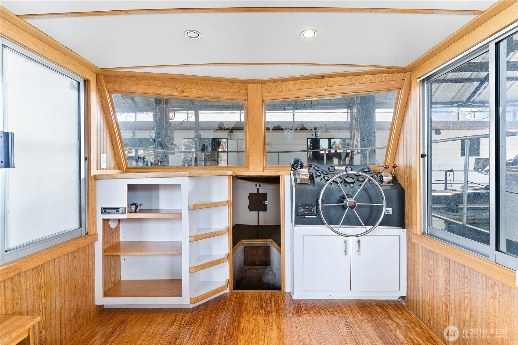 2401 North Northlake Way Seattle, WA 98103 - Photo 5 of 32 a view of a room with wooden floor and bed