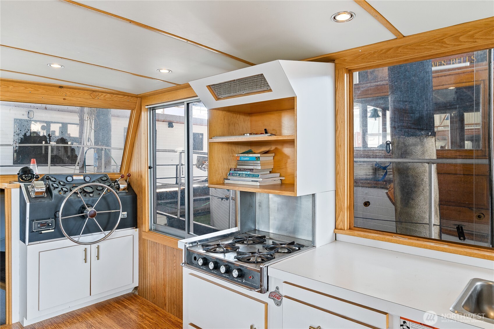 2401 North Northlake Way Seattle, WA 98103 - Photo 6 of 32 a kitchen with stainless steel appliances a stove a sink and a refrigerator