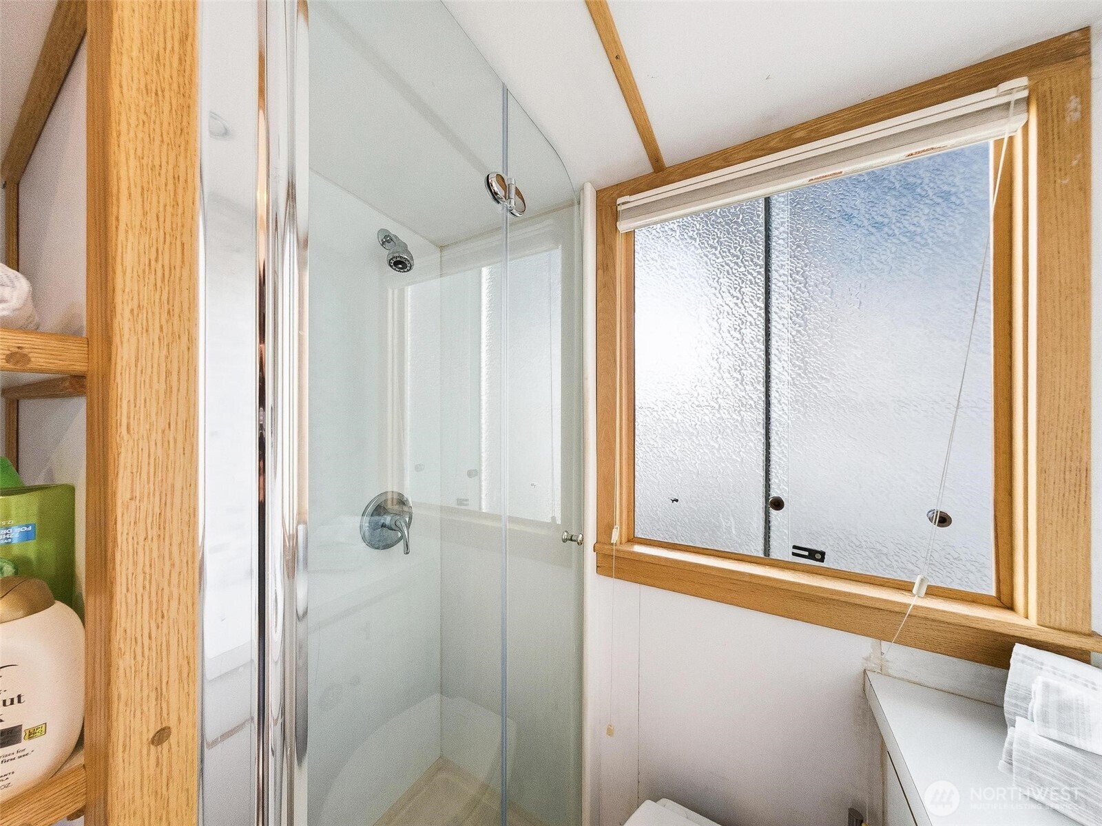 2401 North Northlake Way Seattle, WA 98103 - Photo 7 of 25 a bathroom with a tub and a shower