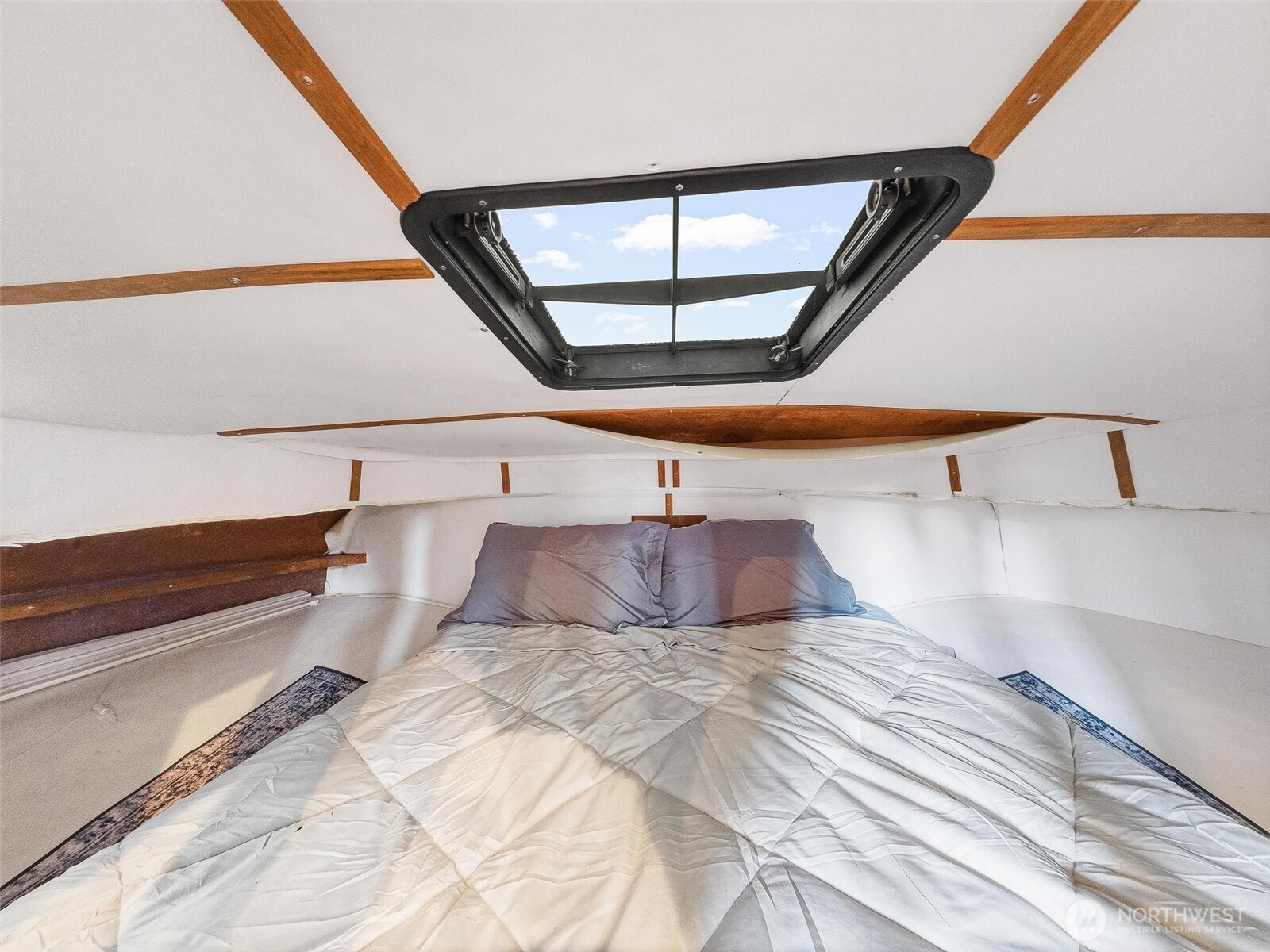 2401 North Northlake Way Seattle, WA 98103 - Photo 10 of 25 a bedroom with a bed and window