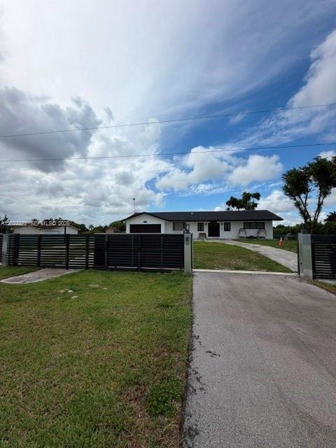 20465 Southwest 200th Street Miami, FL 33187 - Photo 2 of 36 a view of a big yard with houses