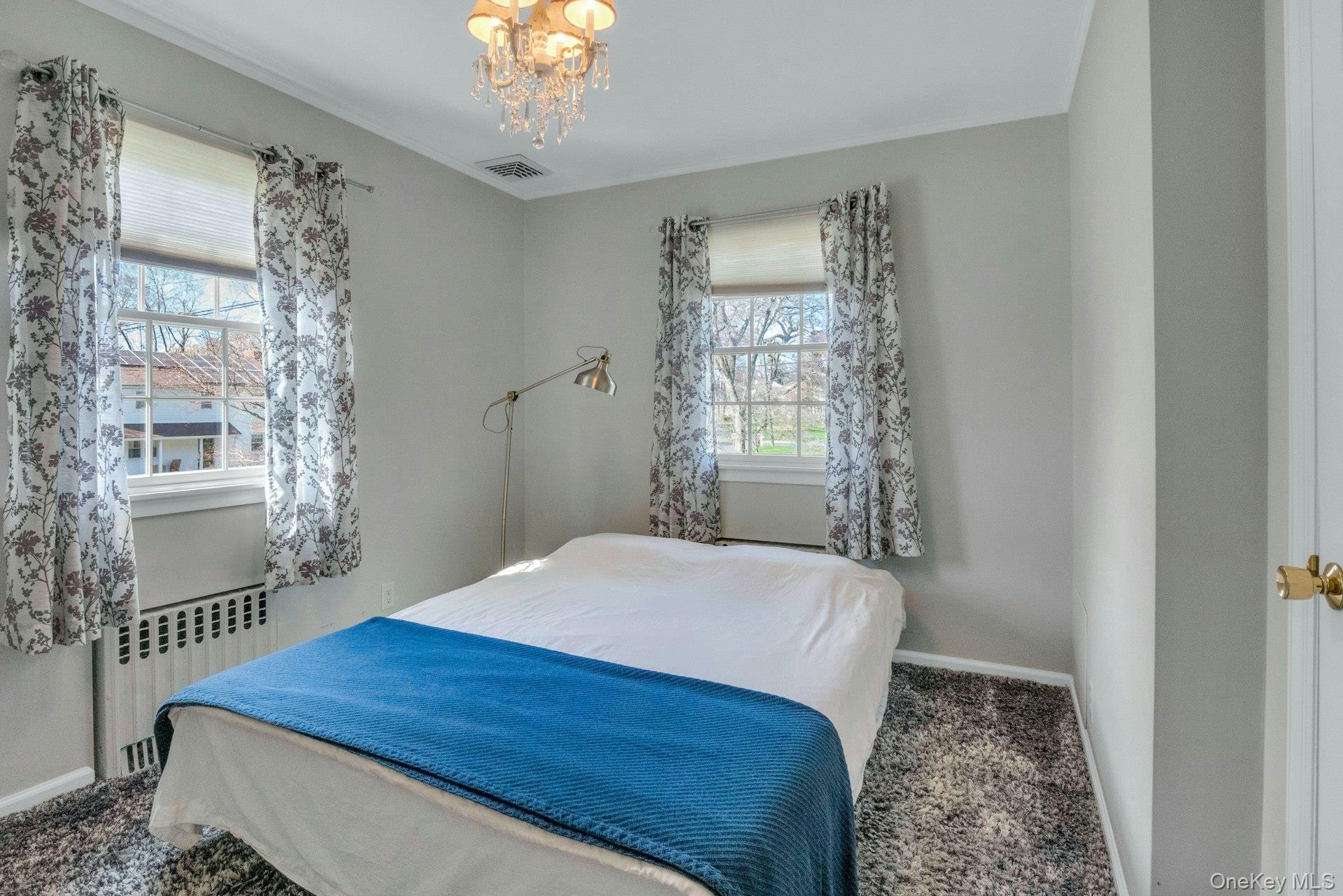 31 Orchard Road Briarcliff Manor, NY 10510 - Photo 12 of 33 a bedroom with a bed and a window