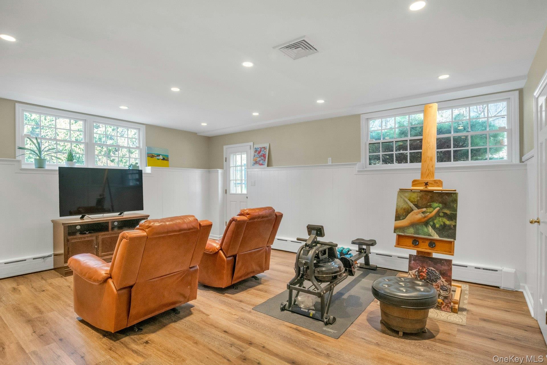 31 Orchard Road Briarcliff Manor, NY 10510 - Photo 15 of 33 a living room with furniture a flat screen tv and a window