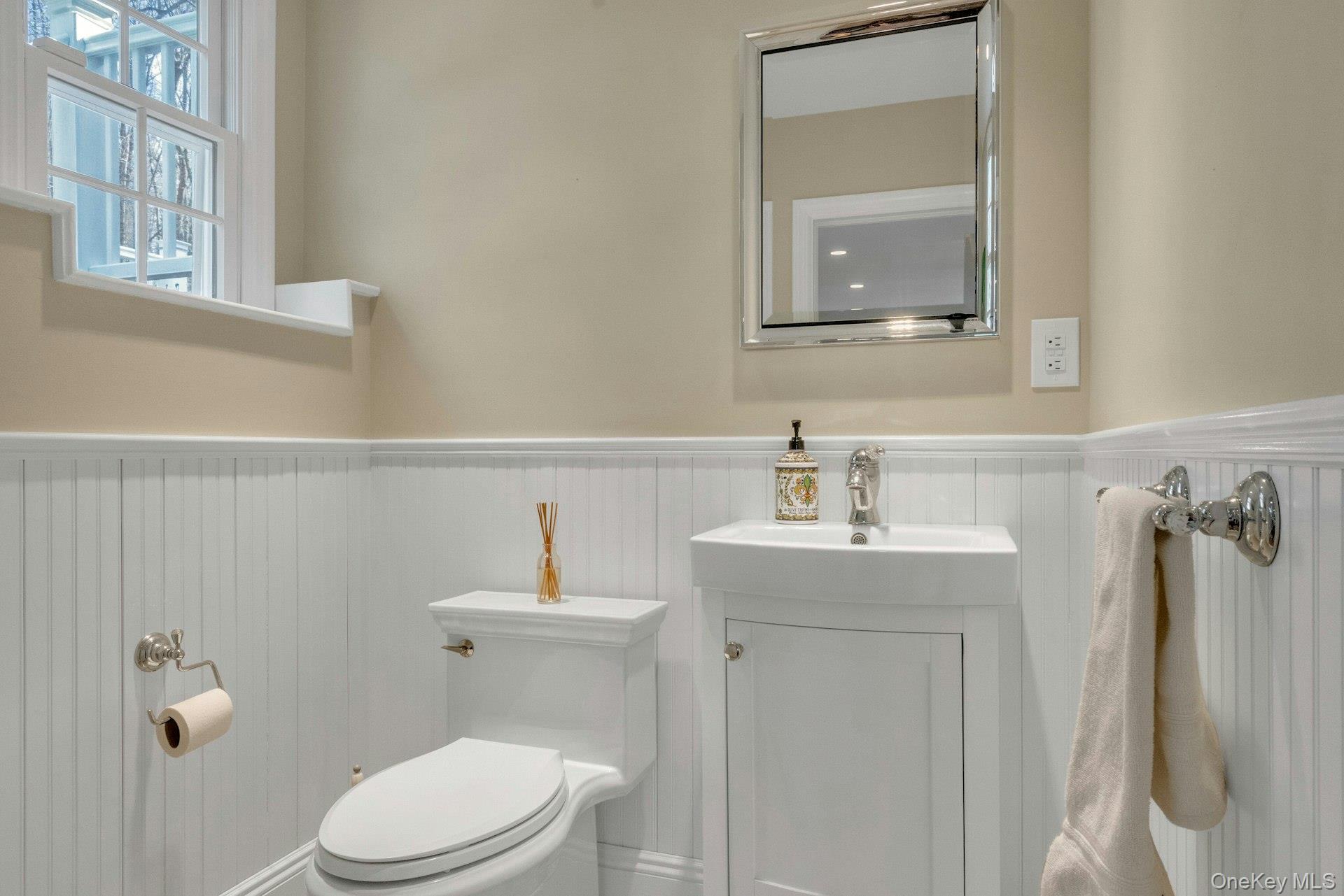 31 Orchard Road Briarcliff Manor, NY 10510 - Photo 16 of 33 a bathroom with a sink a toilet and mirror