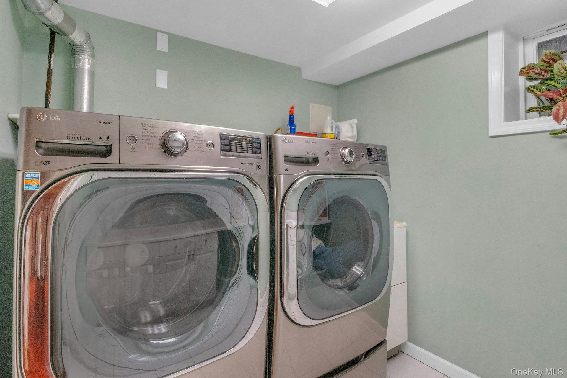 31 Orchard Road Briarcliff Manor, NY 10510 - Photo 19 of 33 a utility room with dryer and washer