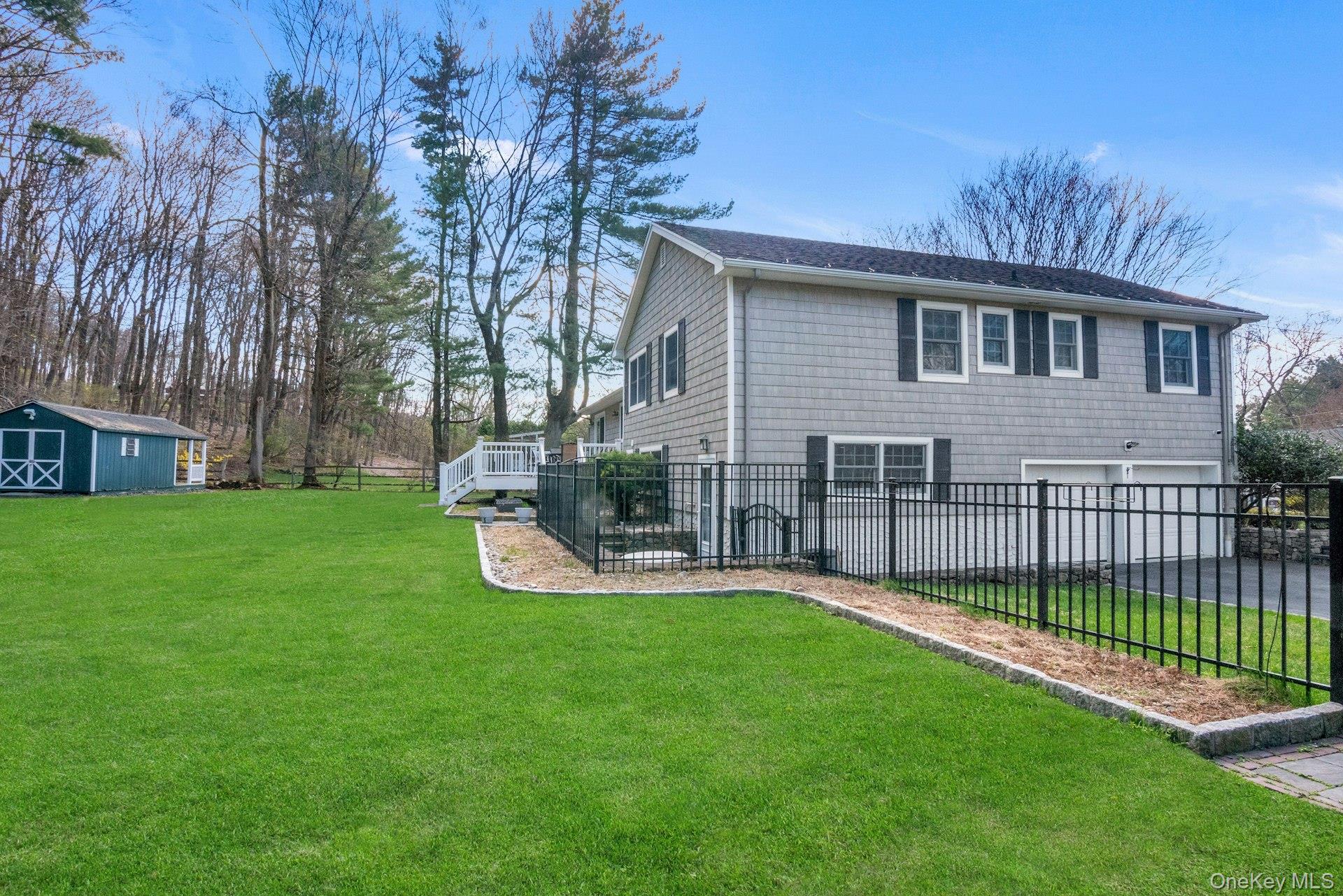 31 Orchard Road Briarcliff Manor, NY 10510 - Photo 27 of 33 a view of a house with a yard and sitting area