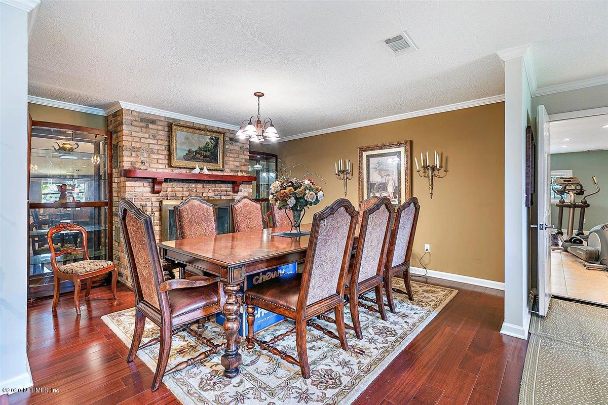 542188 Lem Turner Road Callahan, FL 32011 - Photo 11 of 34 a view of a dining room with furniture and wooden floor