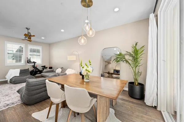 a view of a dining room with furniture window and wooden floor