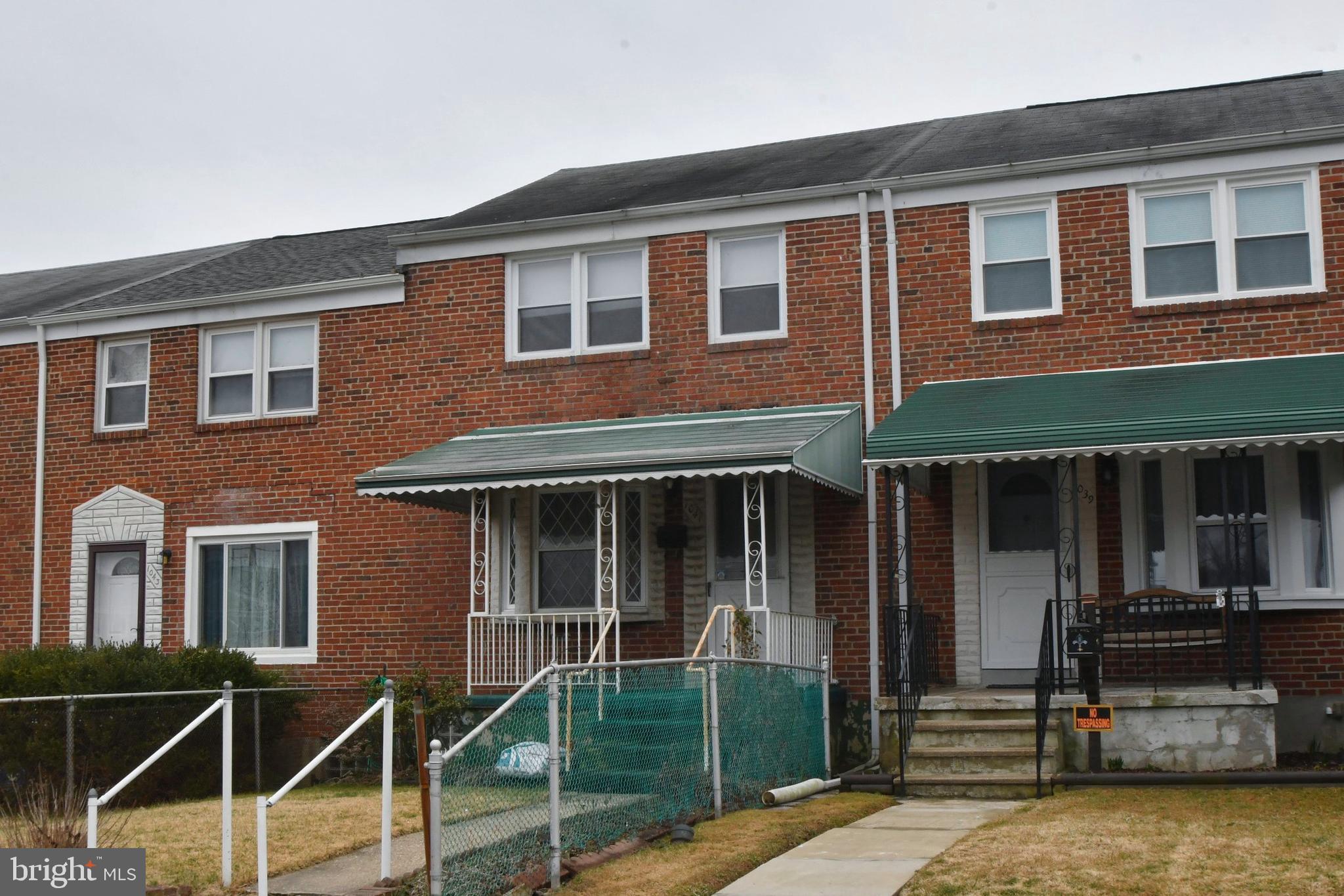 1041 Arncliffe Road Baltimore, MD 21221 - Photo 3 of 40 a front view of a house with a garden