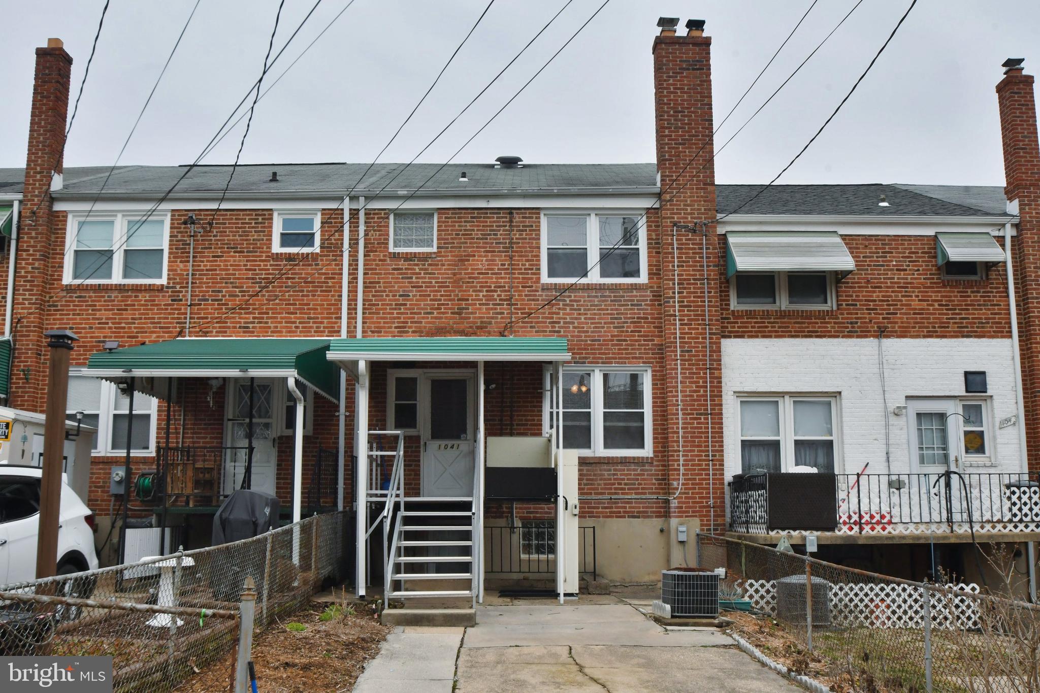 1041 Arncliffe Road Baltimore, MD 21221 - Photo 6 of 40 a front view of a house with glass windows