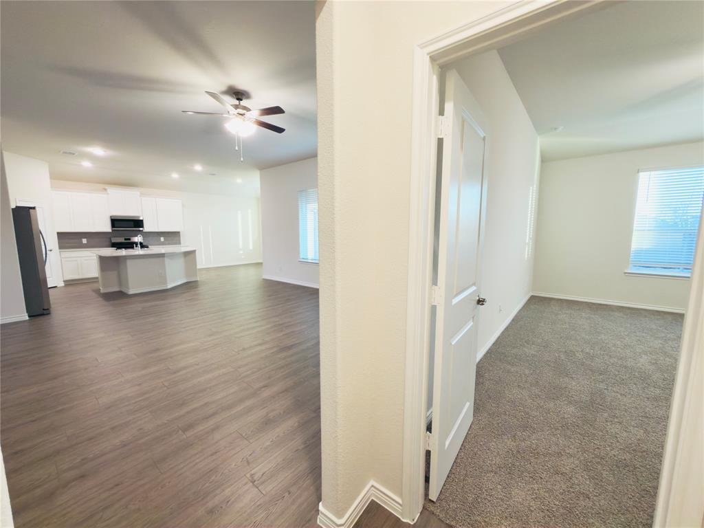 2117 Eugene Street Anna, TX 75409 - Photo 6 of 31 Corridor with recessed lighting and dark wood-style flooring