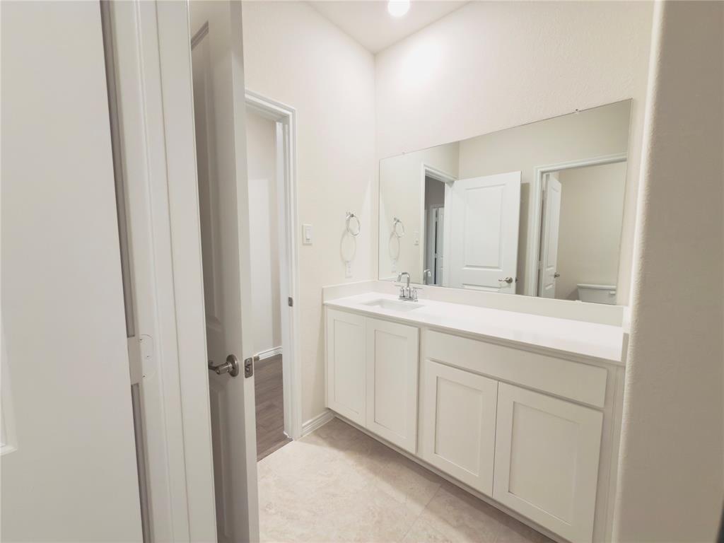 2117 Eugene Street Anna, TX 75409 - Photo 7 of 31 Bathroom with vanity and light tile patterned floors