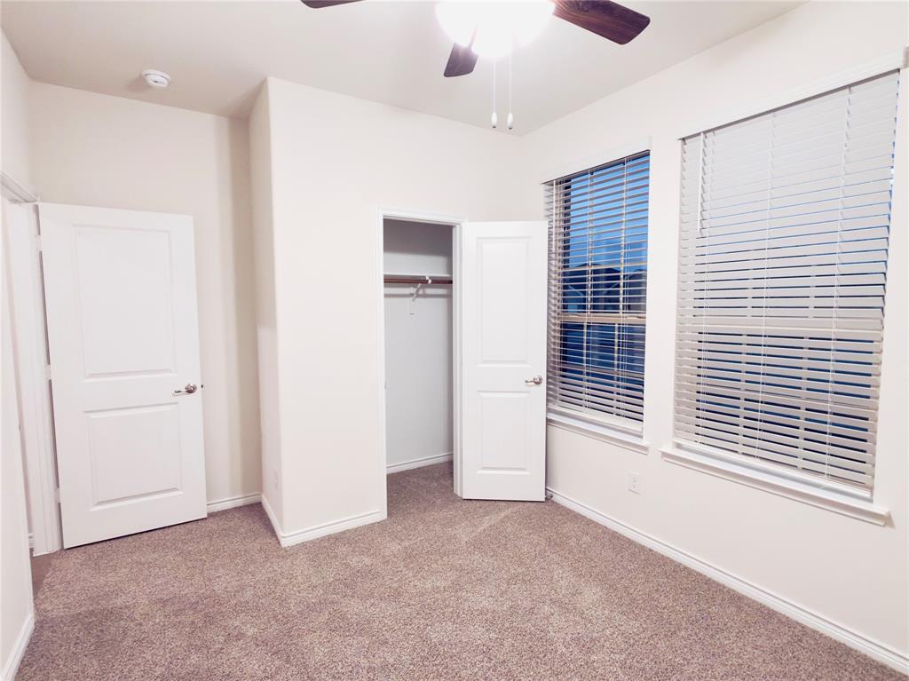 2117 Eugene Street Anna, TX 75409 - Photo 8 of 31 Unfurnished bedroom featuring light colored carpet, a closet, and a ceiling fan