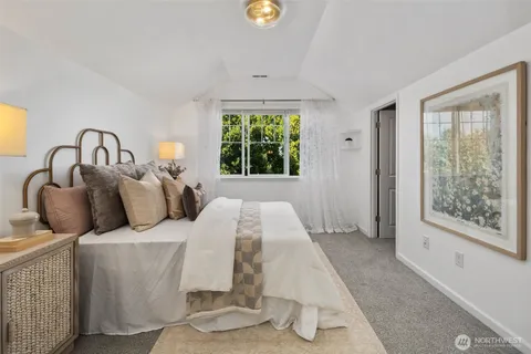 a bed room with a bed and a window