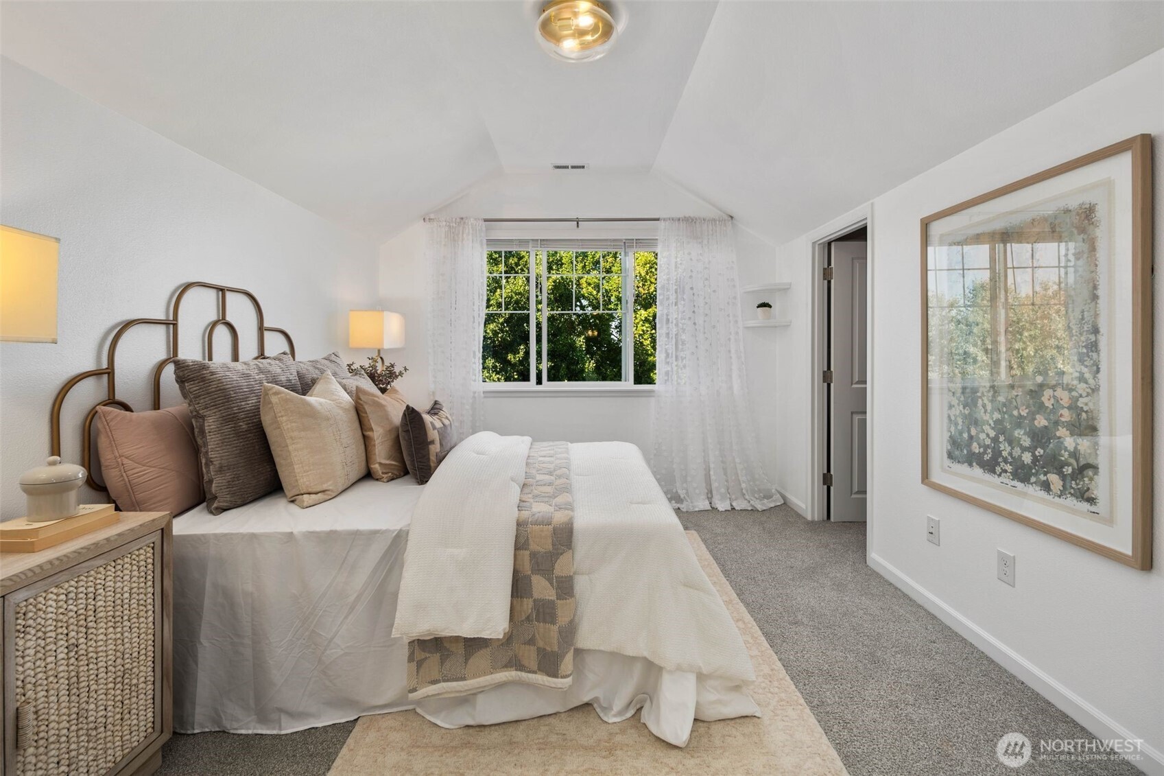 6561 30th Place Southwest Seattle, WA 98126 - Photo 18 of 37 a bed room with a bed and a window