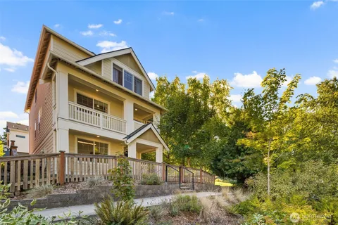 a front view of a house with a garden