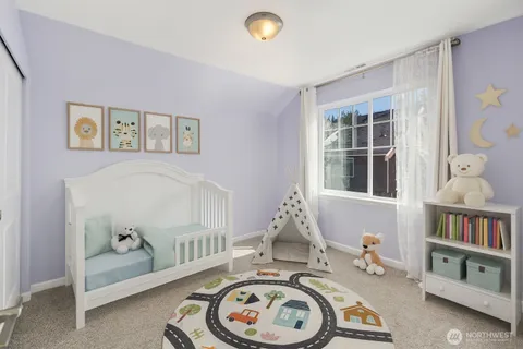 a bedroom with furniture and a window