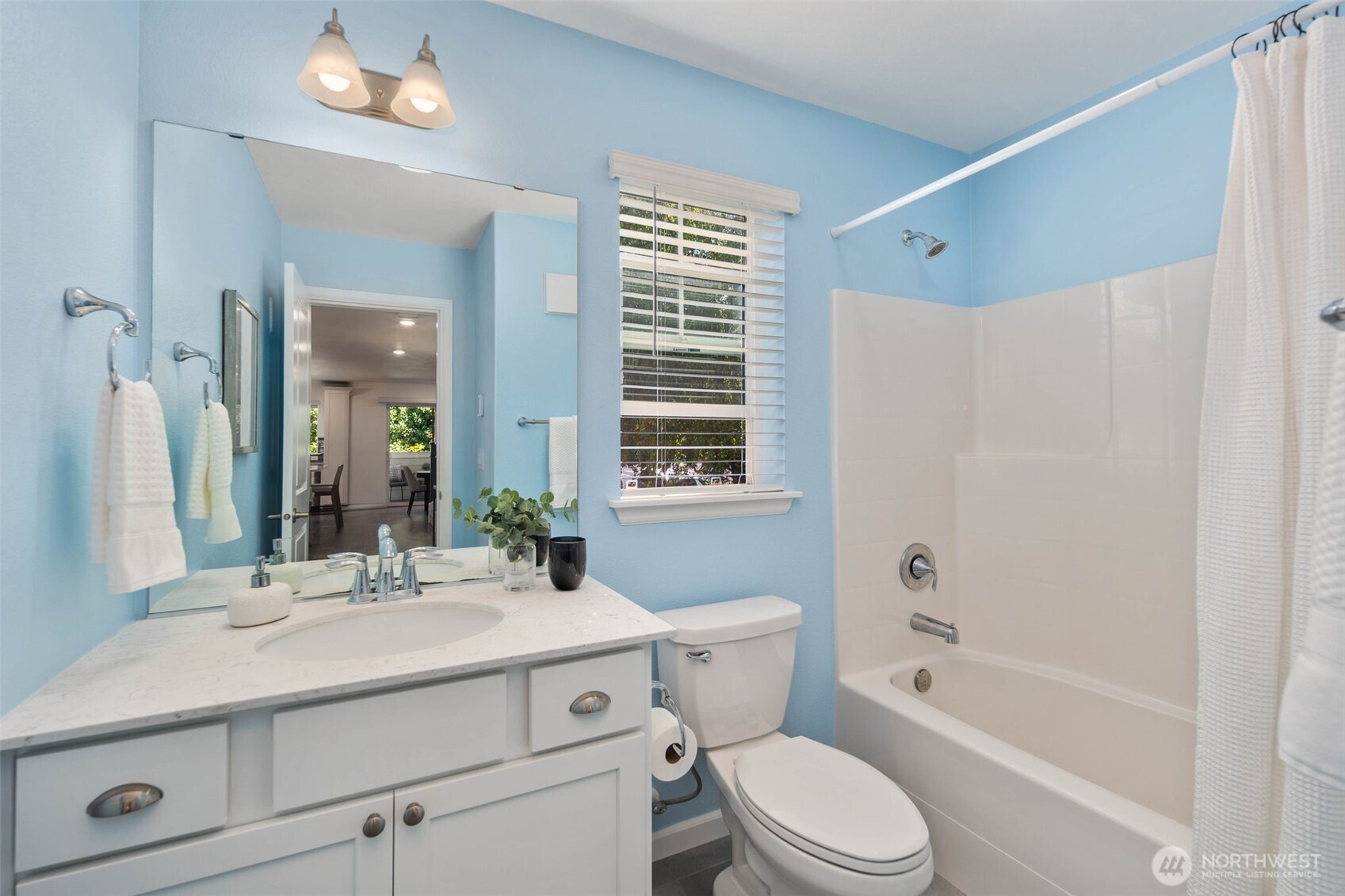 6561 30th Place Southwest Seattle, WA 98126 - Photo 24 of 37 a bathroom with a sink toilet a mirror and shower