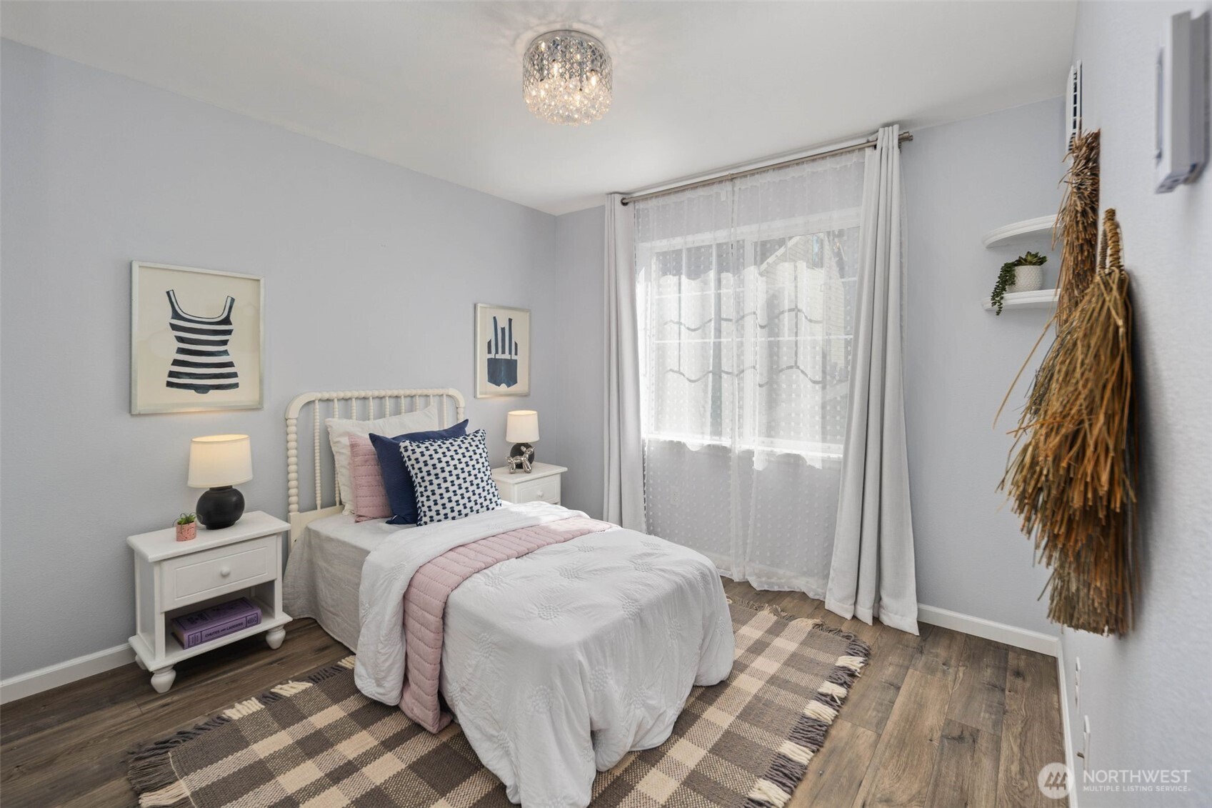 6561 30th Place Southwest Seattle, WA 98126 - Photo 26 of 37 a bedroom with a bed and a painting on the wall