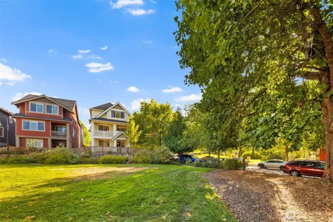 a front view of a residential apartment building with a yard
