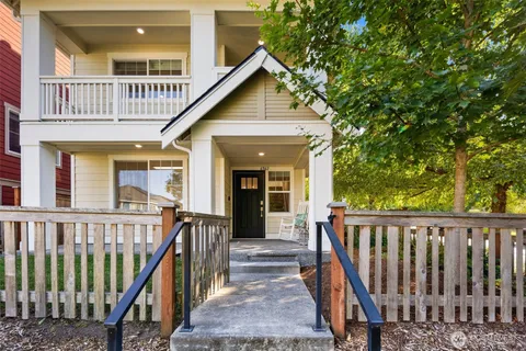 a view of a house with wooden deck