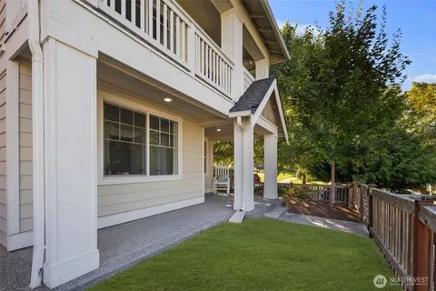 a view of house with backyard porch and entertaining space