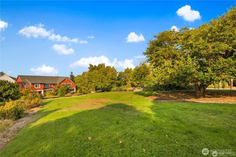 a view of a golf course with a big yard