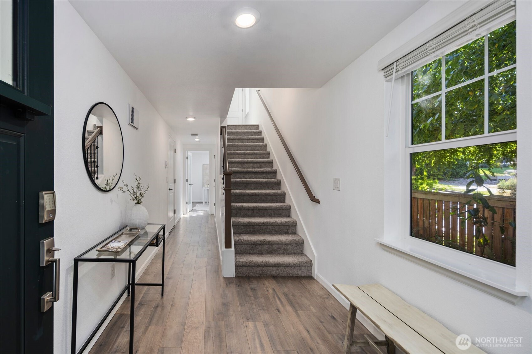 6561 30th Place Southwest Seattle, WA 98126 - Photo 4 of 37 a view of a hallway with wooden floor and white walls