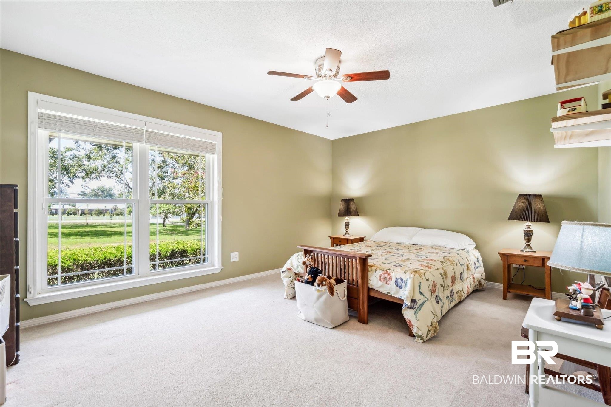 8710 Three Notch Road Mobile, AL 36619 - Photo 19 of 30 Carpeted bedroom with ceiling fan