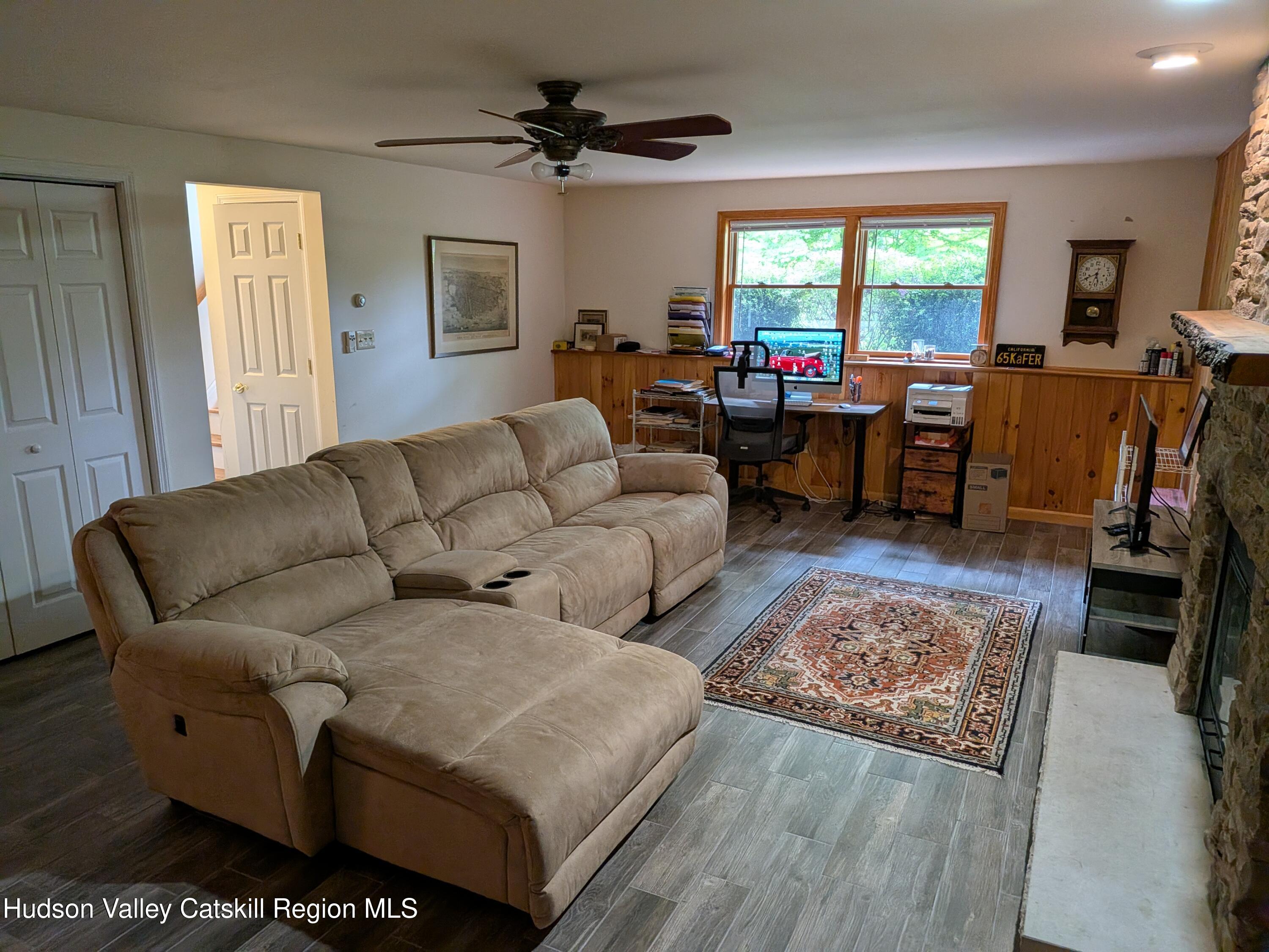 513 South Mountain Road Gardiner, NY 12525 - Photo 33 of 63 a living room with furniture and a flat screen tv