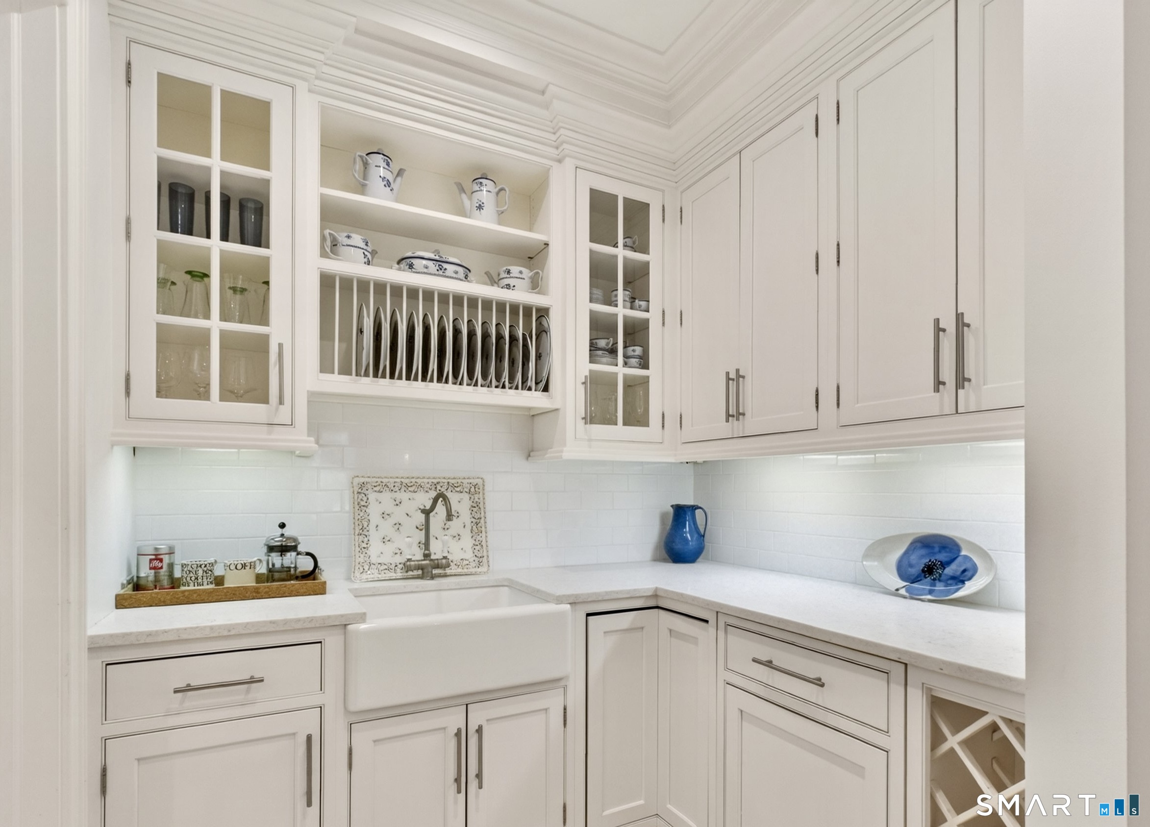 41 Peaceable Street Ridgefield, CT 06877 - Photo 19 of 40 a kitchen with white cabinets and sink