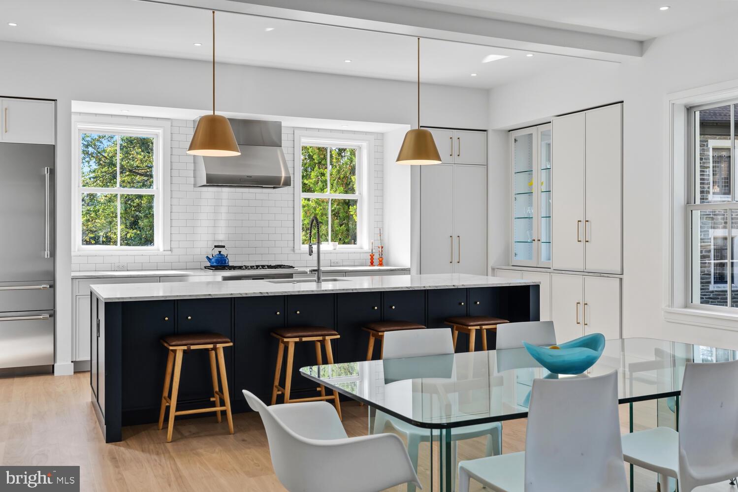 14 Pelham Road Philadelphia, PA 19119 - Photo 12 of 49 a kitchen with stainless steel appliances granite countertop a table and chairs