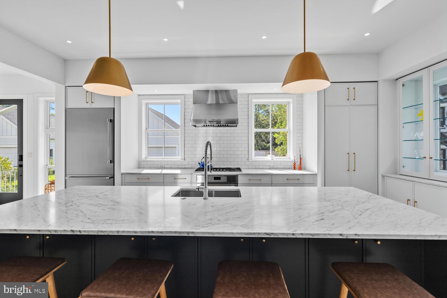 14 Pelham Road Philadelphia, PA 19119 - Photo 13 of 49 a kitchen with center island table and chairs in it