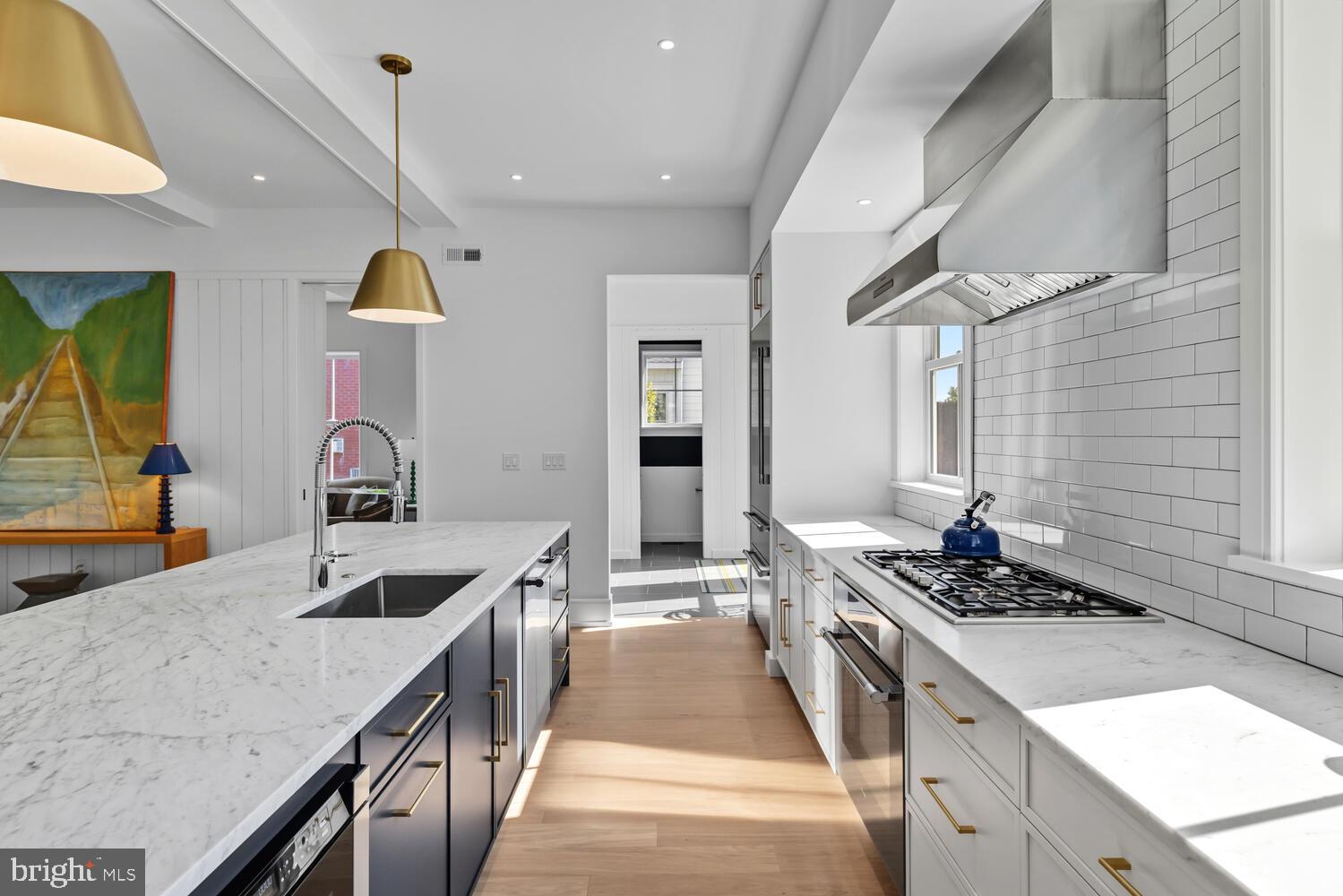 14 Pelham Road Philadelphia, PA 19119 - Photo 15 of 49 a kitchen with stainless steel appliances granite countertop a sink stove and cabinets