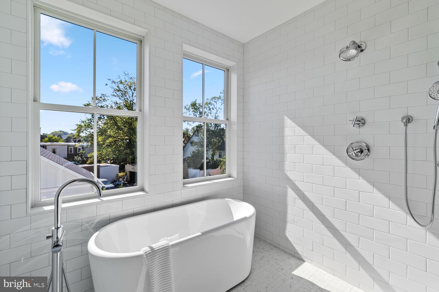 14 Pelham Road Philadelphia, PA 19119 - Photo 31 of 49 a bathroom with a bathtub and window