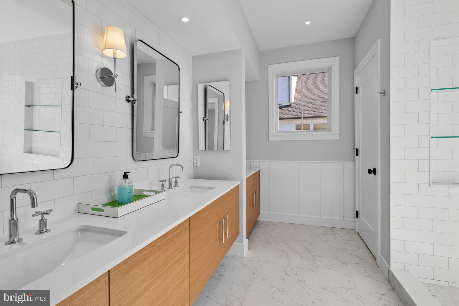 14 Pelham Road Philadelphia, PA 19119 - Photo 33 of 49 a bathroom with double vanity sinks and a mirror