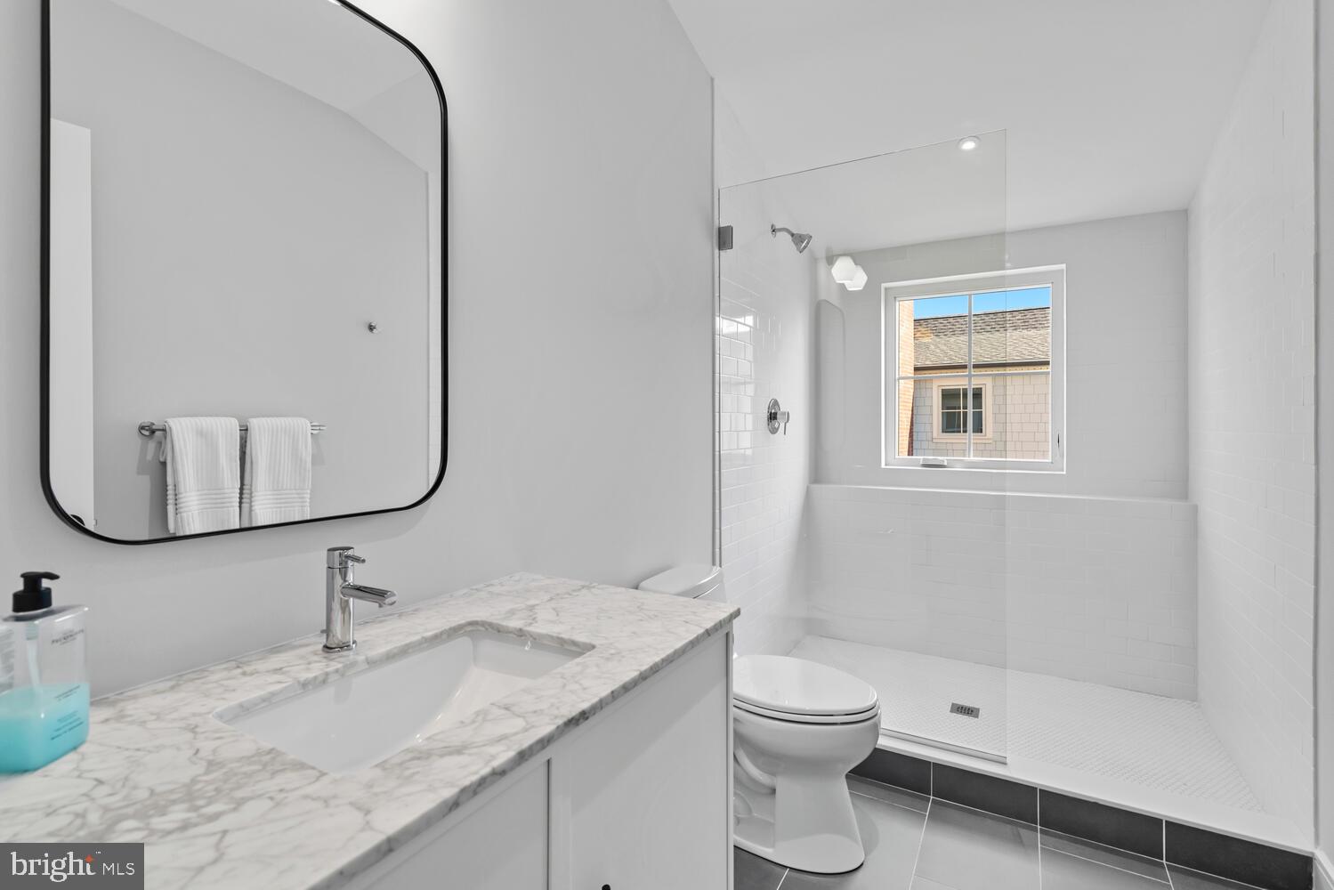 14 Pelham Road Philadelphia, PA 19119 - Photo 43 of 49 a bathroom with a granite countertop sink a toilet and shower