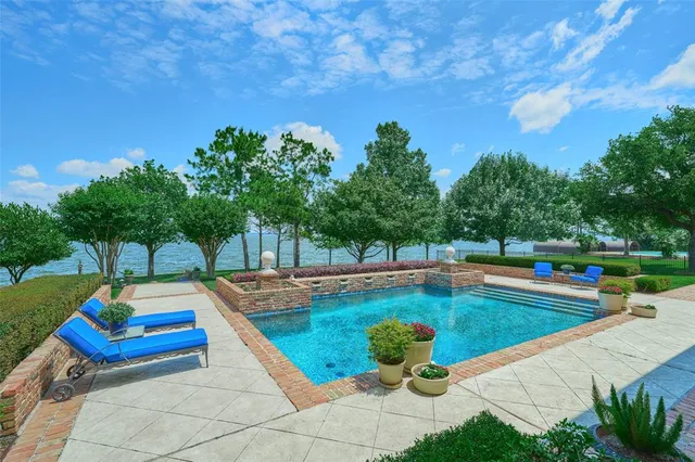 a view of a swimming pool with lounge chair