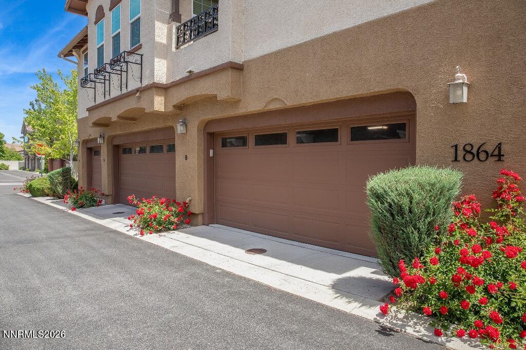 1864 Wind Ranch Road, Unit B Reno, NV 89521 - Photo 2 of 42 a front view of a house