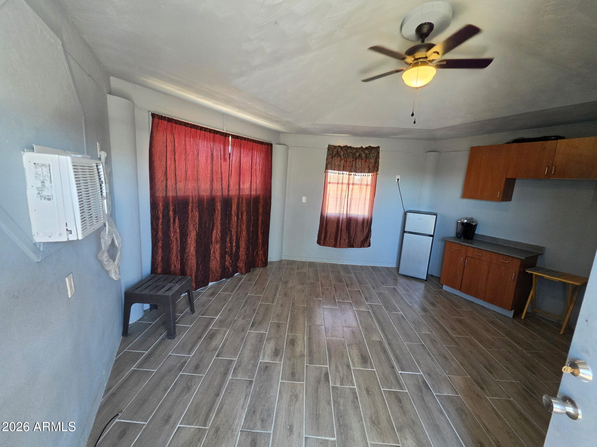 4333 West Carver Road, Unit B Laveen, AZ 85339 - Photo 1 of 6 a view of empty room with a fireplace and wooden floor