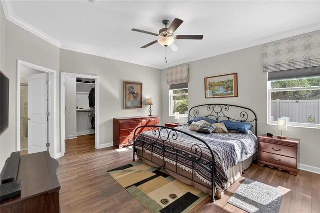 a spacious bathroom with a toilet sink and mirror