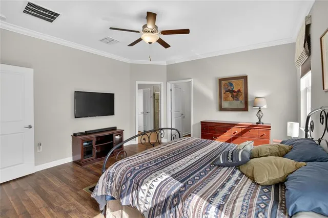 a view of room with workspace and wooden floor