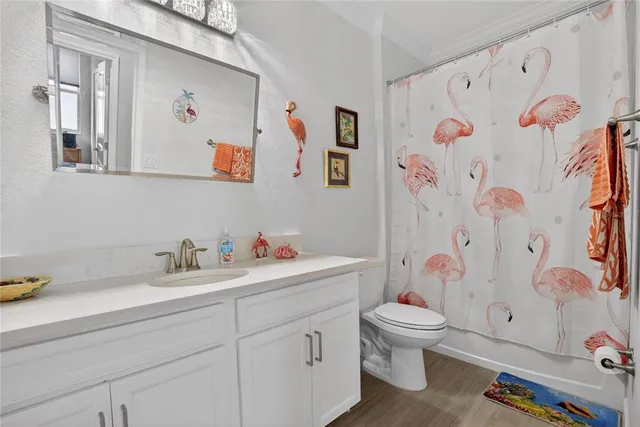 a bedroom with furniture and a large window